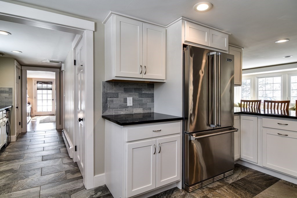 85 Walpole Street Dover, MA 02030 - Photo 10 of 39 a kitchen with stainless steel appliances a refrigerator and a stove