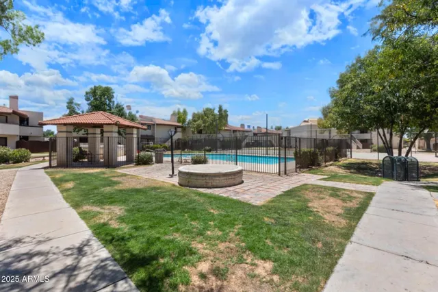 a view of a house with sitting area and a yard
