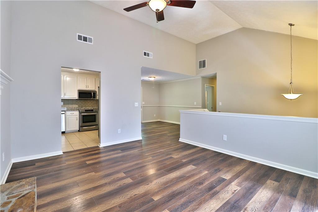 353 Fall View Court Winder, GA 30680 - Photo 24 of 61 a view of empty room with wooden floor and fan