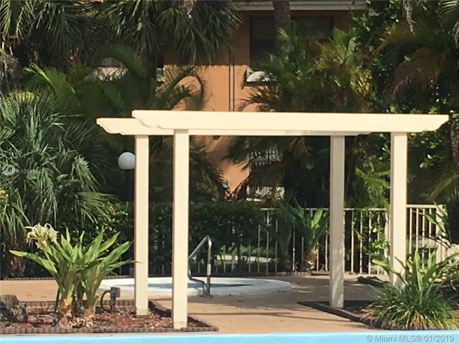 7120 Northwest 179th Street, Unit 101 Hialeah, FL 33015 - Photo 1 of 18