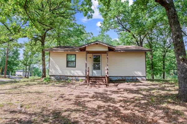 a backyard of a house with trees