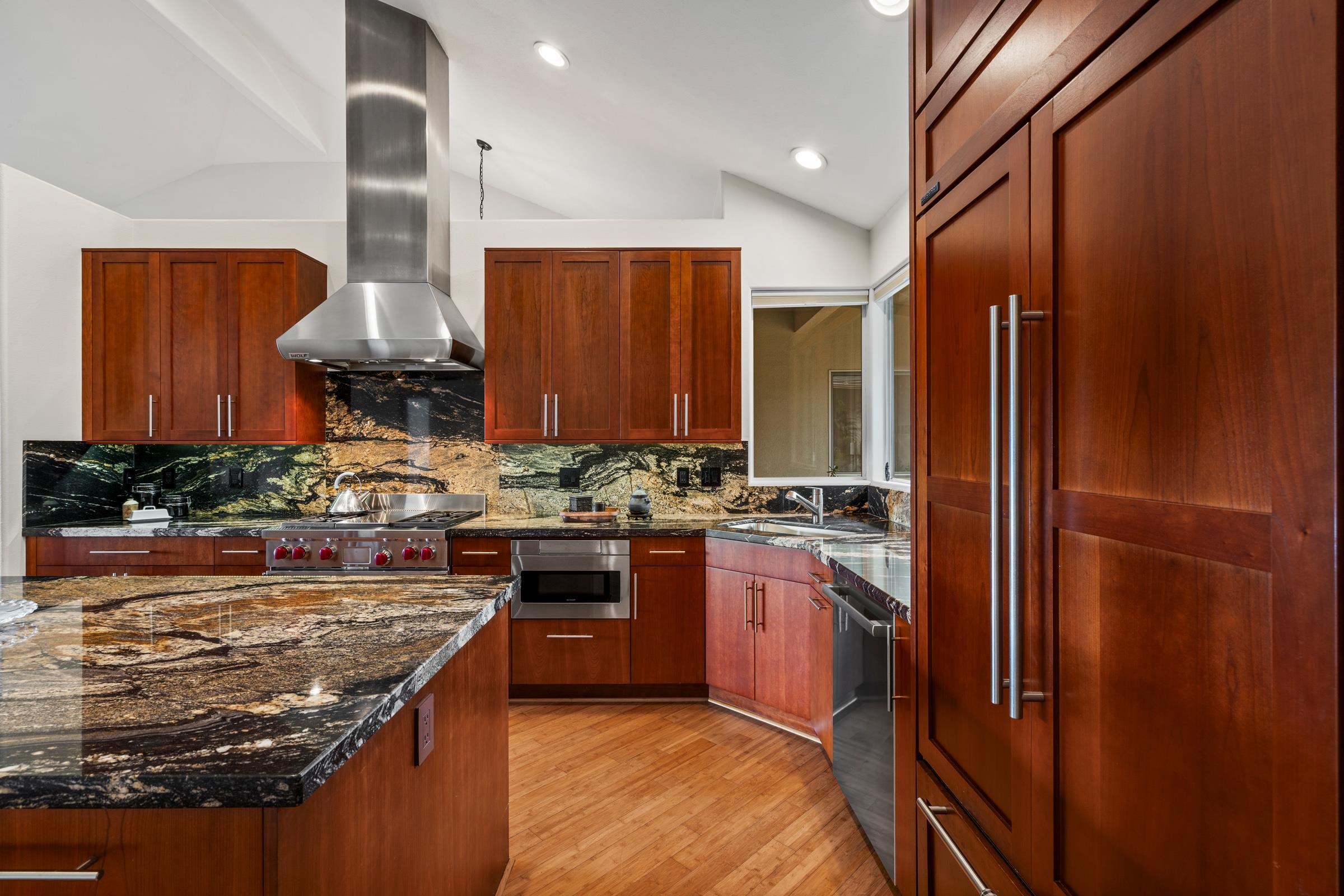 33 U'au Place Kula, HI 96790 - Photo 28 of 50 a kitchen with stainless steel appliances granite countertop sink stove and refrigerator