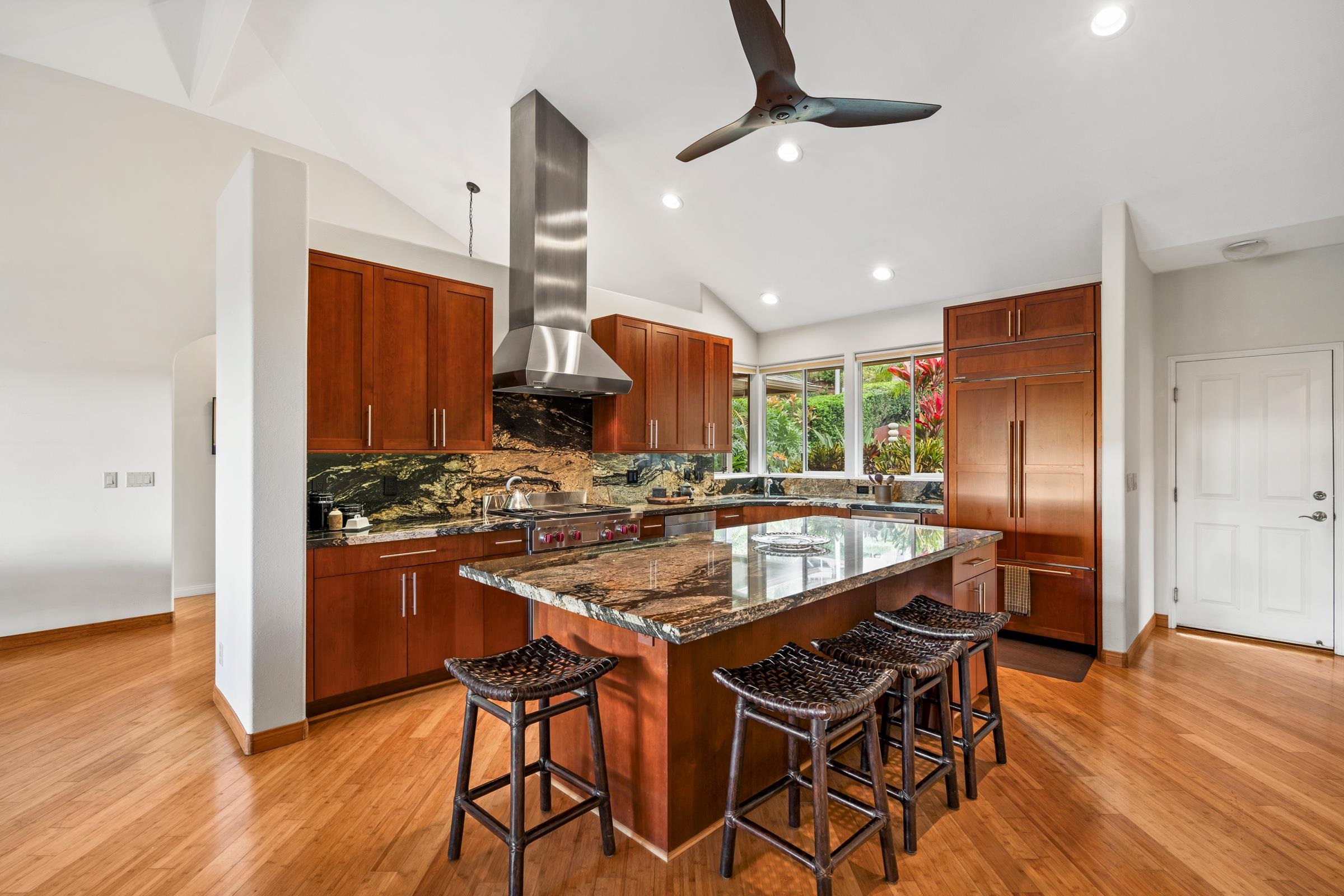 33 U'au Place Kula, HI 96790 - Photo 4 of 50 a kitchen with stainless steel appliances granite countertop wooden floor and chairs