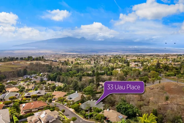 a sign board with parking space in back