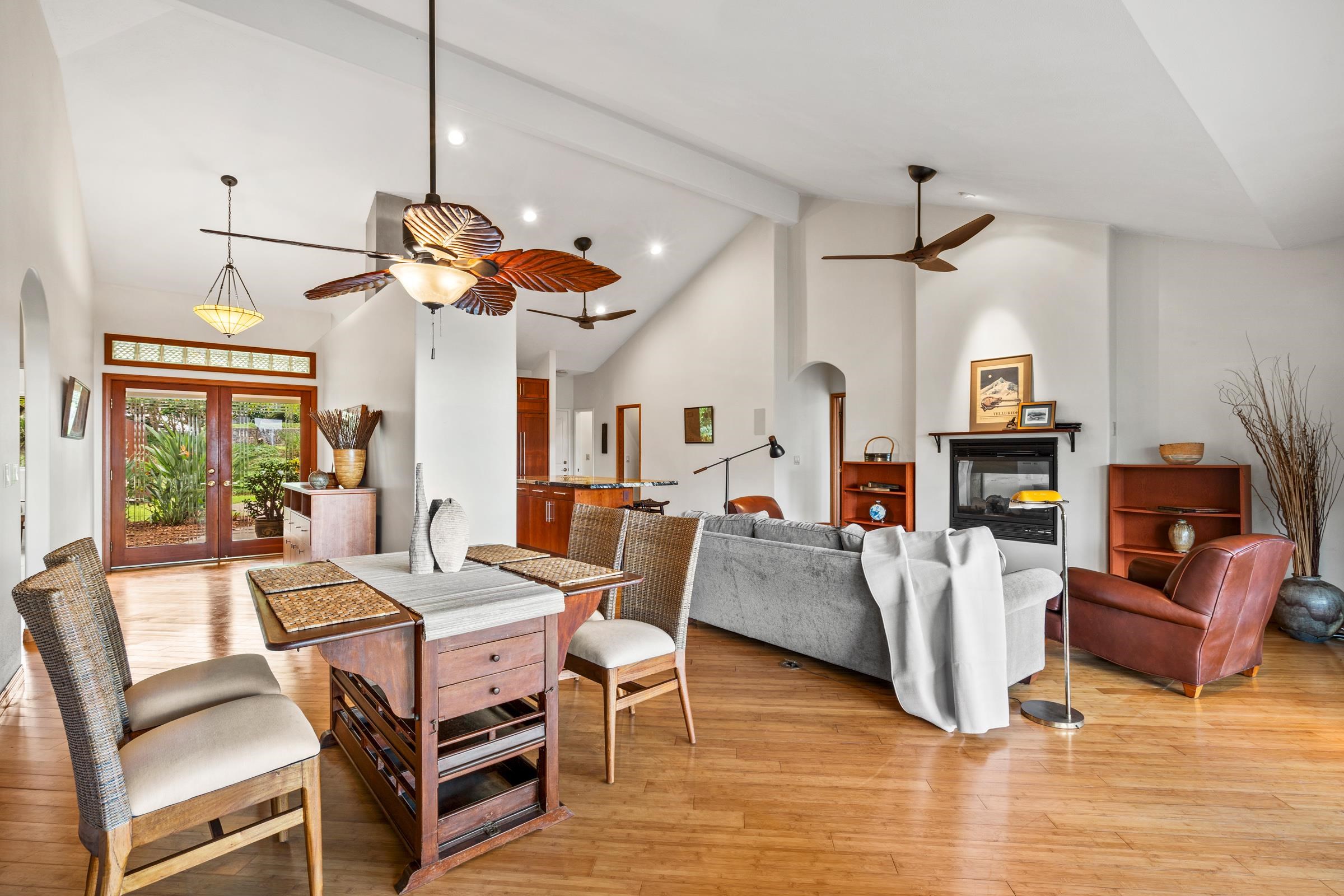 33 U'au Place Kula, HI 96790 - Photo 7 of 50 a view of a dining room with furniture a fireplace and wooden floor
