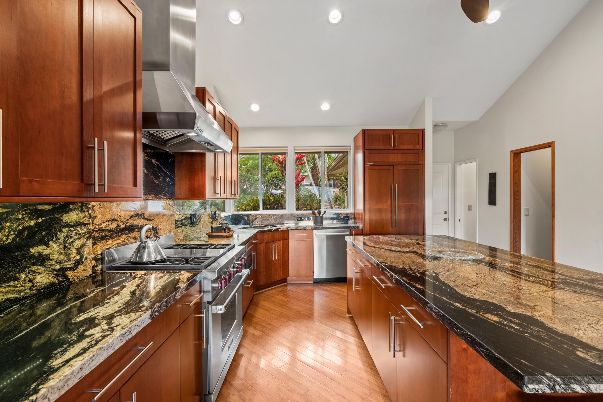 33 U'au Place Kula, HI 96790 - Photo 9 of 50 a kitchen with stainless steel appliances granite countertop a sink stove and refrigerator