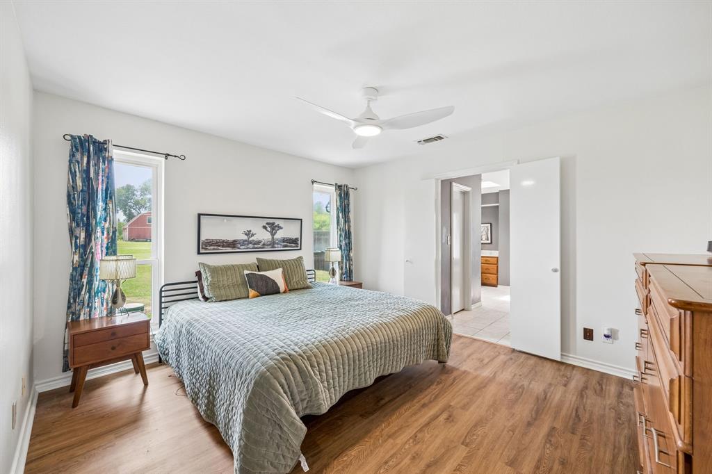 5 Orchard Road Lucas, TX 75002 - Photo 11 of 34 Interior space featuring wood-finish flooring, white walls, and a contemporary ceiling fan