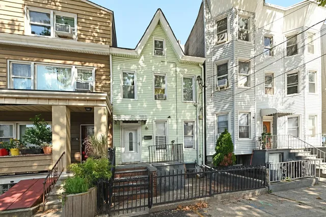 a view of a brick building with many windows