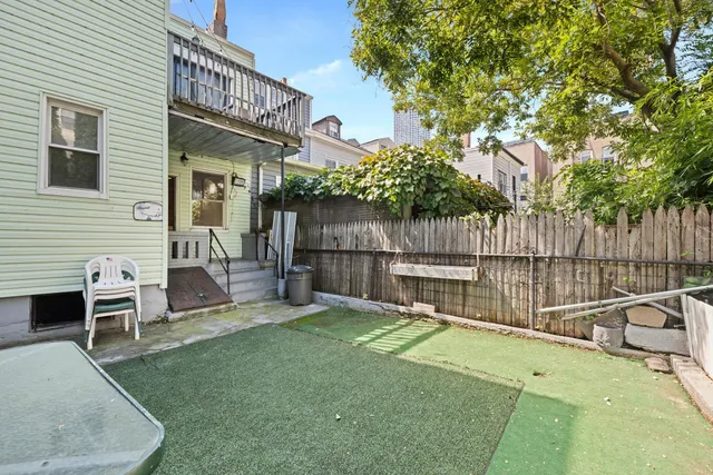 a view of a chair and table in the patio