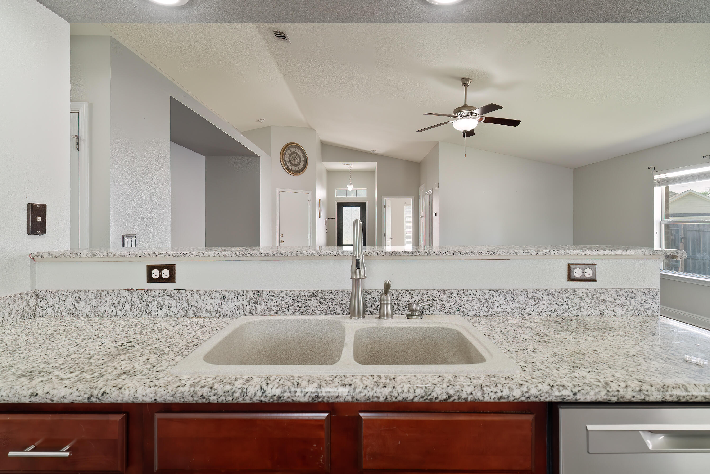 4633 Hermosa Road Crestview, FL 32539 - Photo 20 of 53 a kitchen with granite countertop a sink a counter top space and cabinets