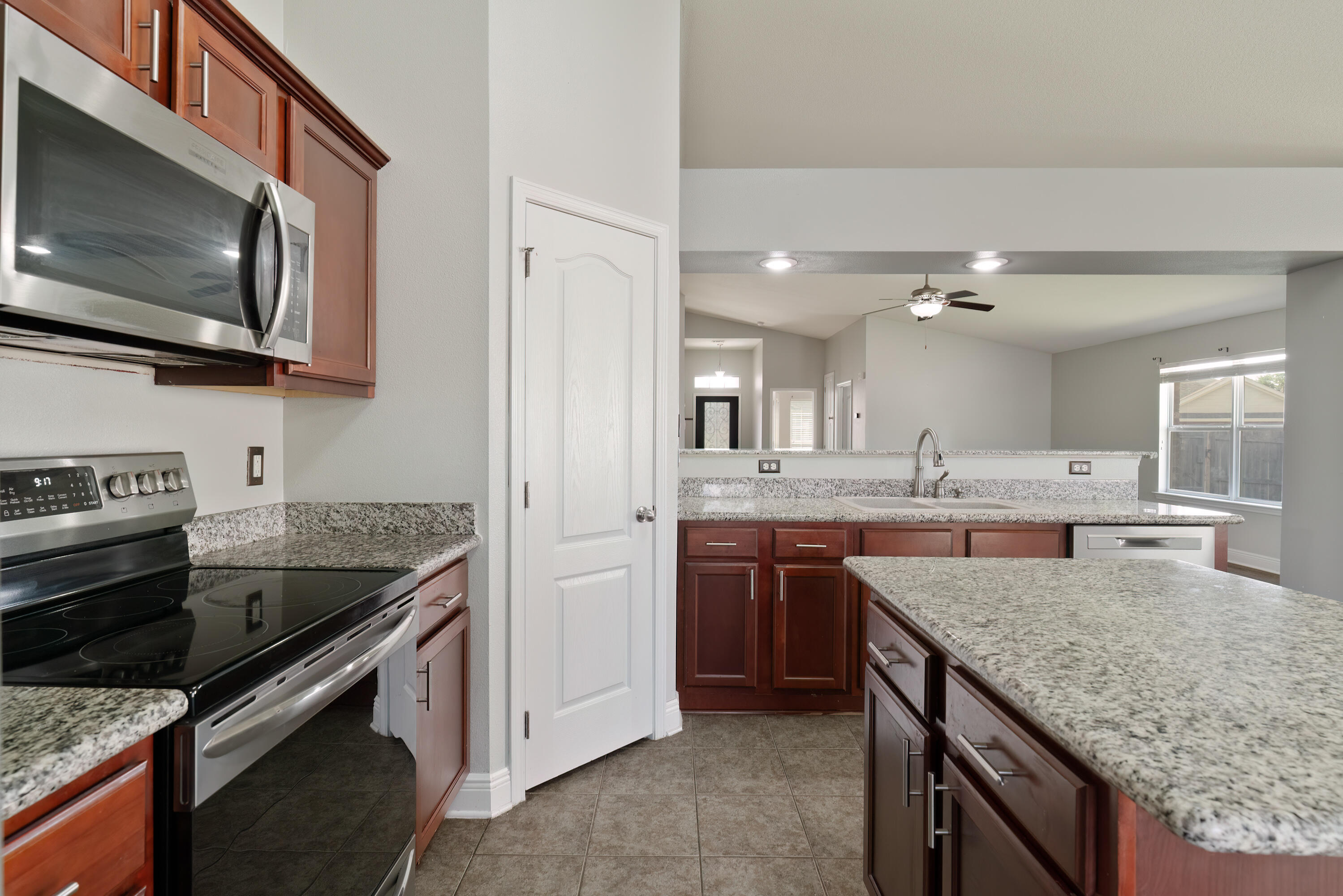 4633 Hermosa Road Crestview, FL 32539 - Photo 21 of 53 a kitchen with a stove and a microwave