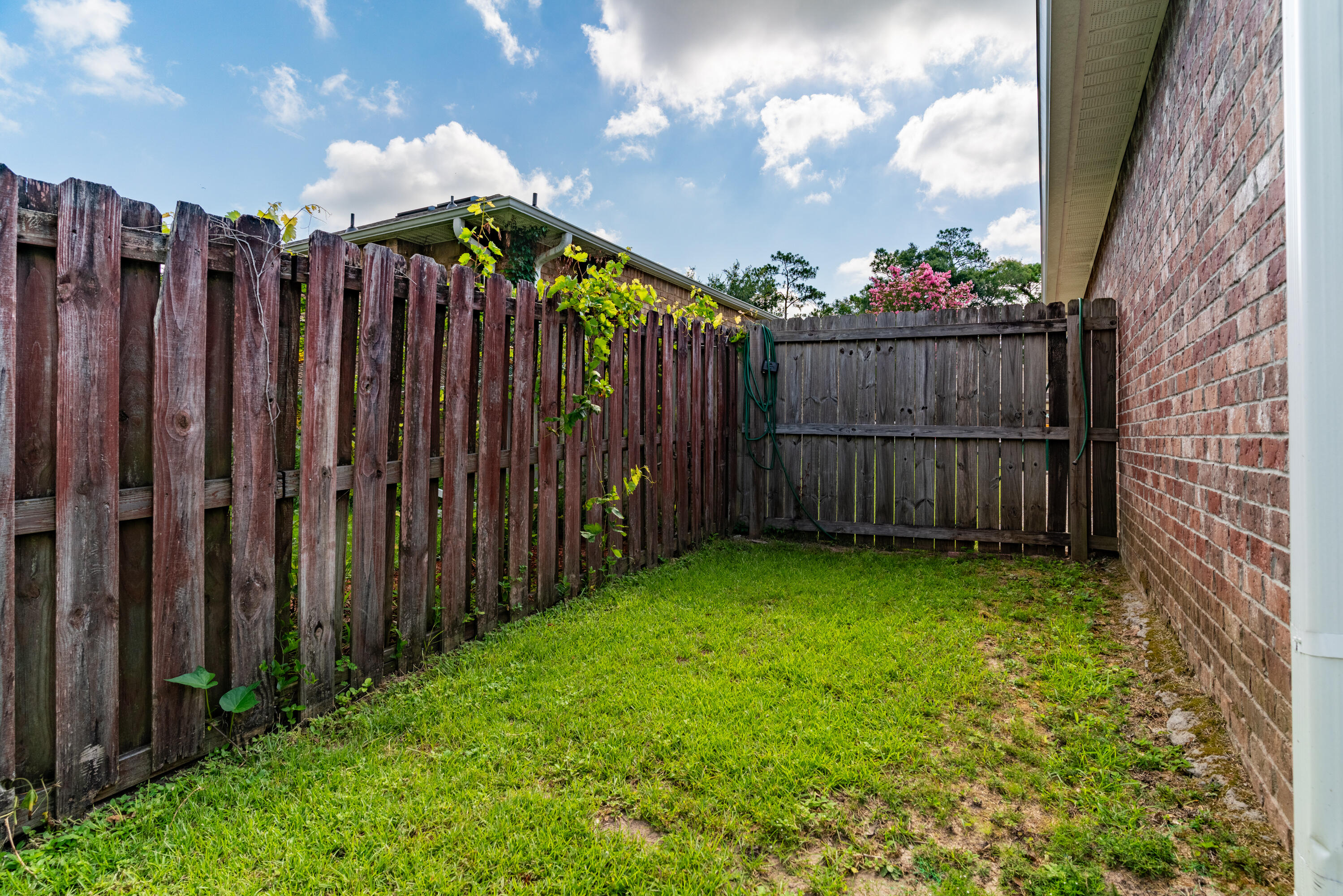 4633 Hermosa Road Crestview, FL 32539 - Photo 45 of 53 a view of a backyard with wooden fence