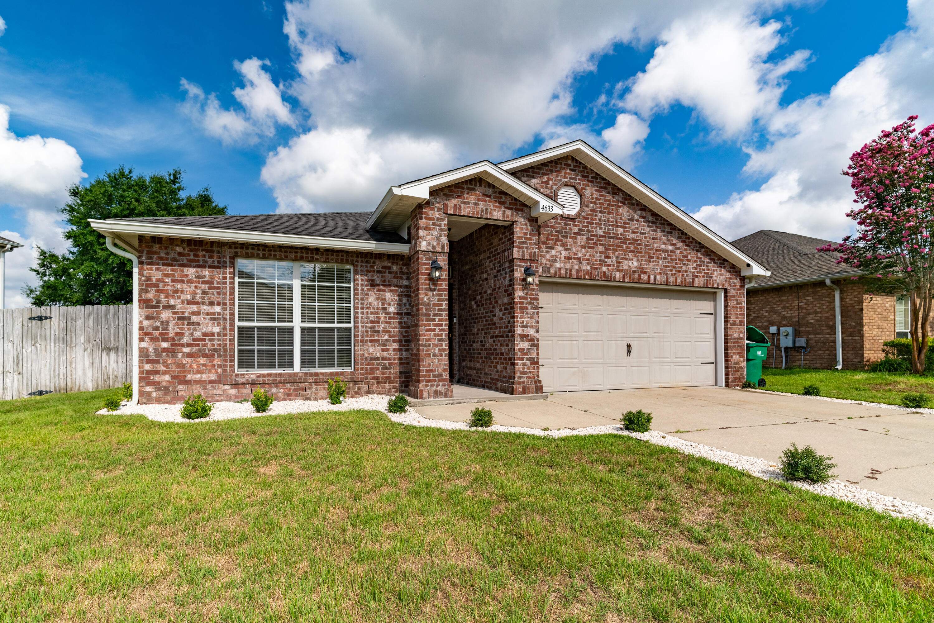 4633 Hermosa Road Crestview, FL 32539 - Photo 51 of 53 a front view of a house with a yard and garage