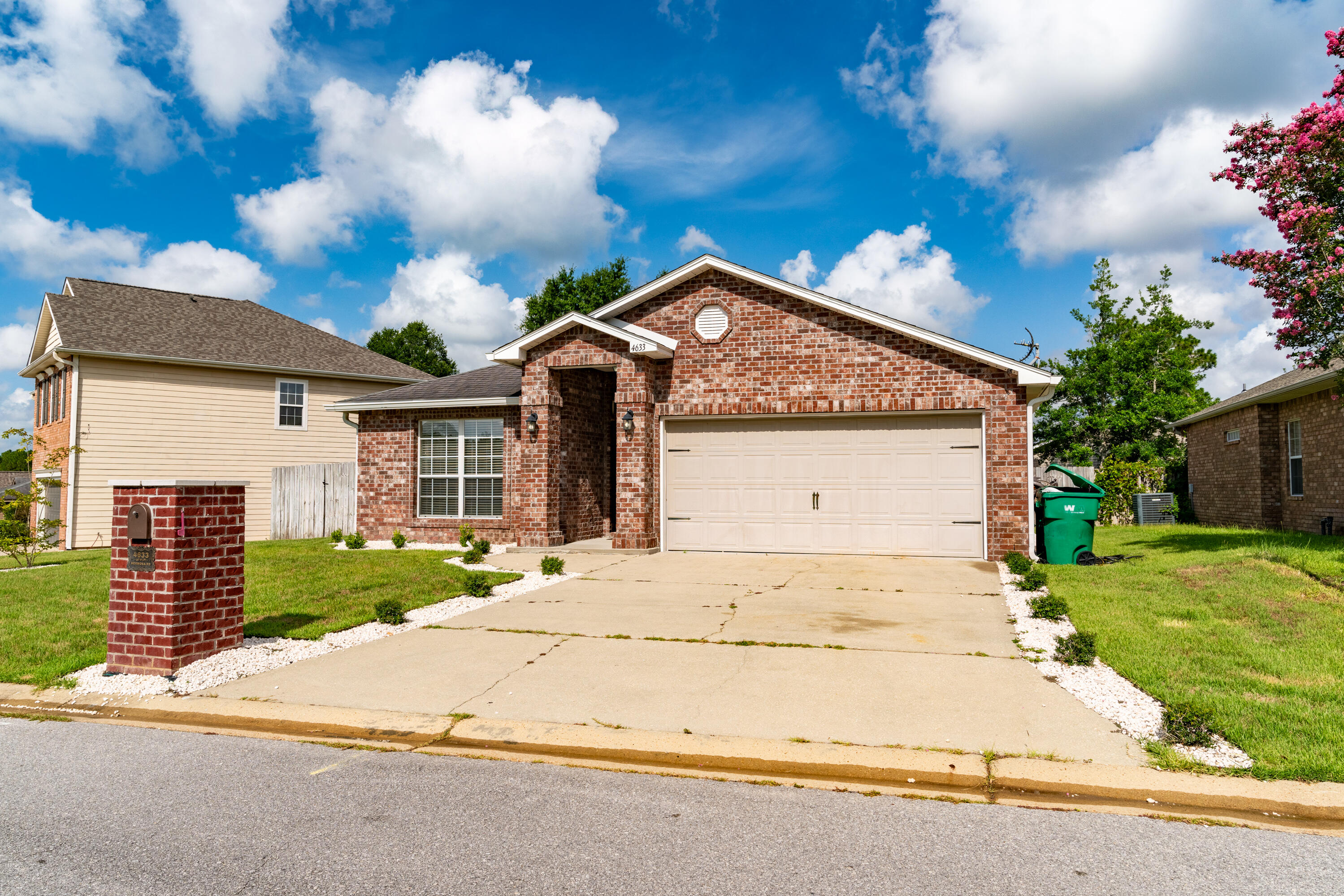 4633 Hermosa Road Crestview, FL 32539 - Photo 52 of 53 a front view of a house with a yard and garage