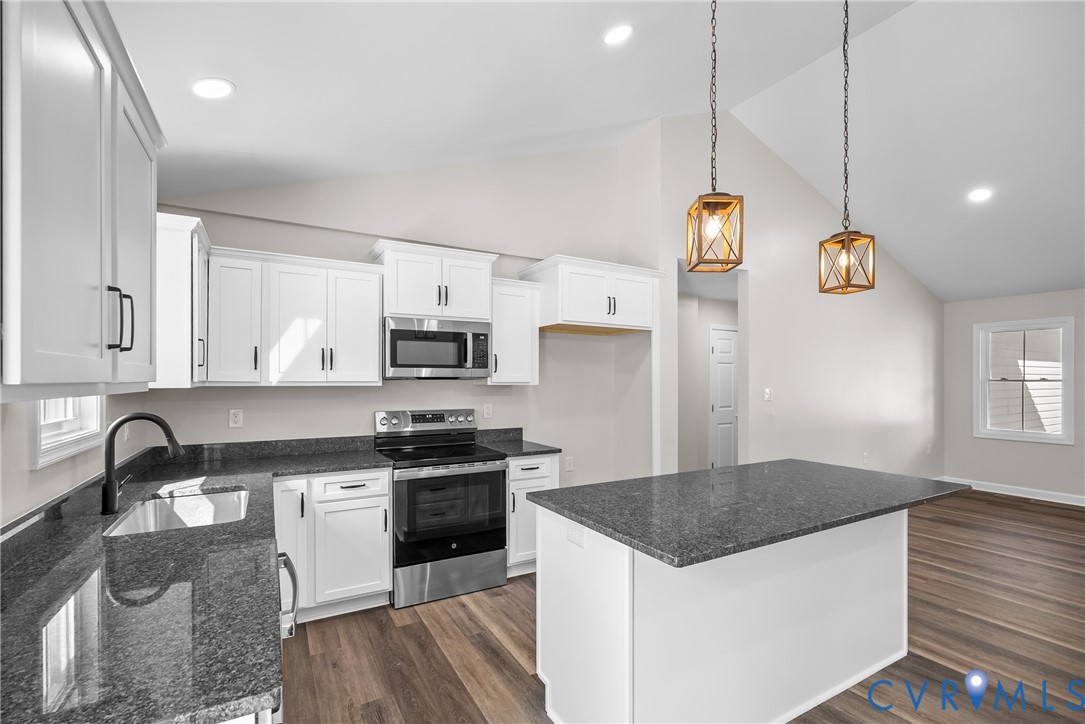 1373 Twenty Two Road Pamplin, VA 23958 - Photo 12 of 39 a kitchen with stainless steel appliances granite countertop a sink a stove and a refrigerator