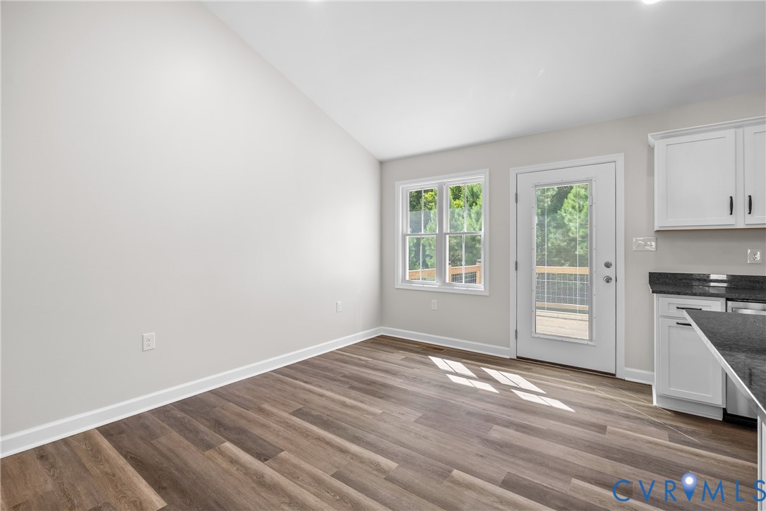 1373 Twenty Two Road Pamplin, VA 23958 - Photo 14 of 39 wooden floor in an empty room with a window