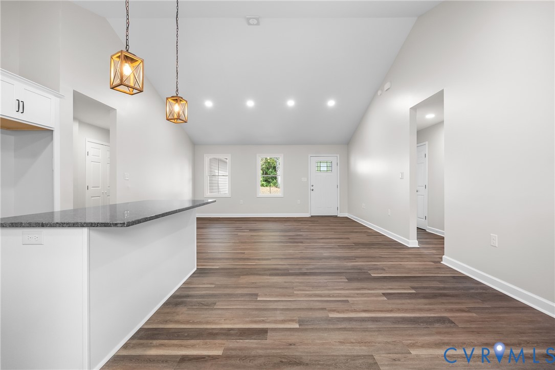 1373 Twenty Two Road Pamplin, VA 23958 - Photo 16 of 39 a view of an empty room with window and wooden floor