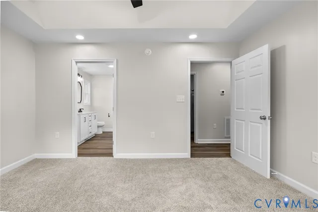 a bathroom with a double vanity sink toilet and a mirror