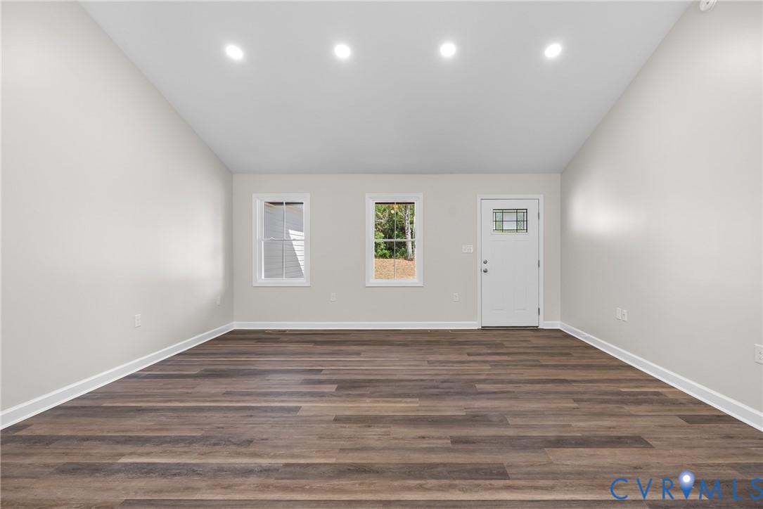 1373 Twenty Two Road Pamplin, VA 23958 - Photo 8 of 39 an empty room with wooden floor and windows