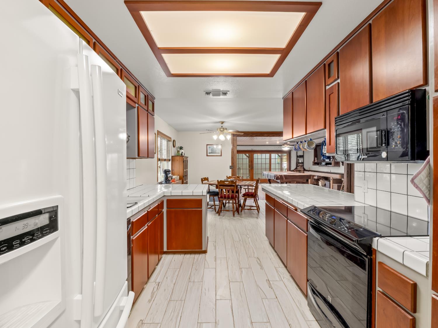 845 Elwood Road Squaw Valley, CA 93675 - Photo 22 of 67 a kitchen with stainless steel appliances granite countertop a stove and a sink