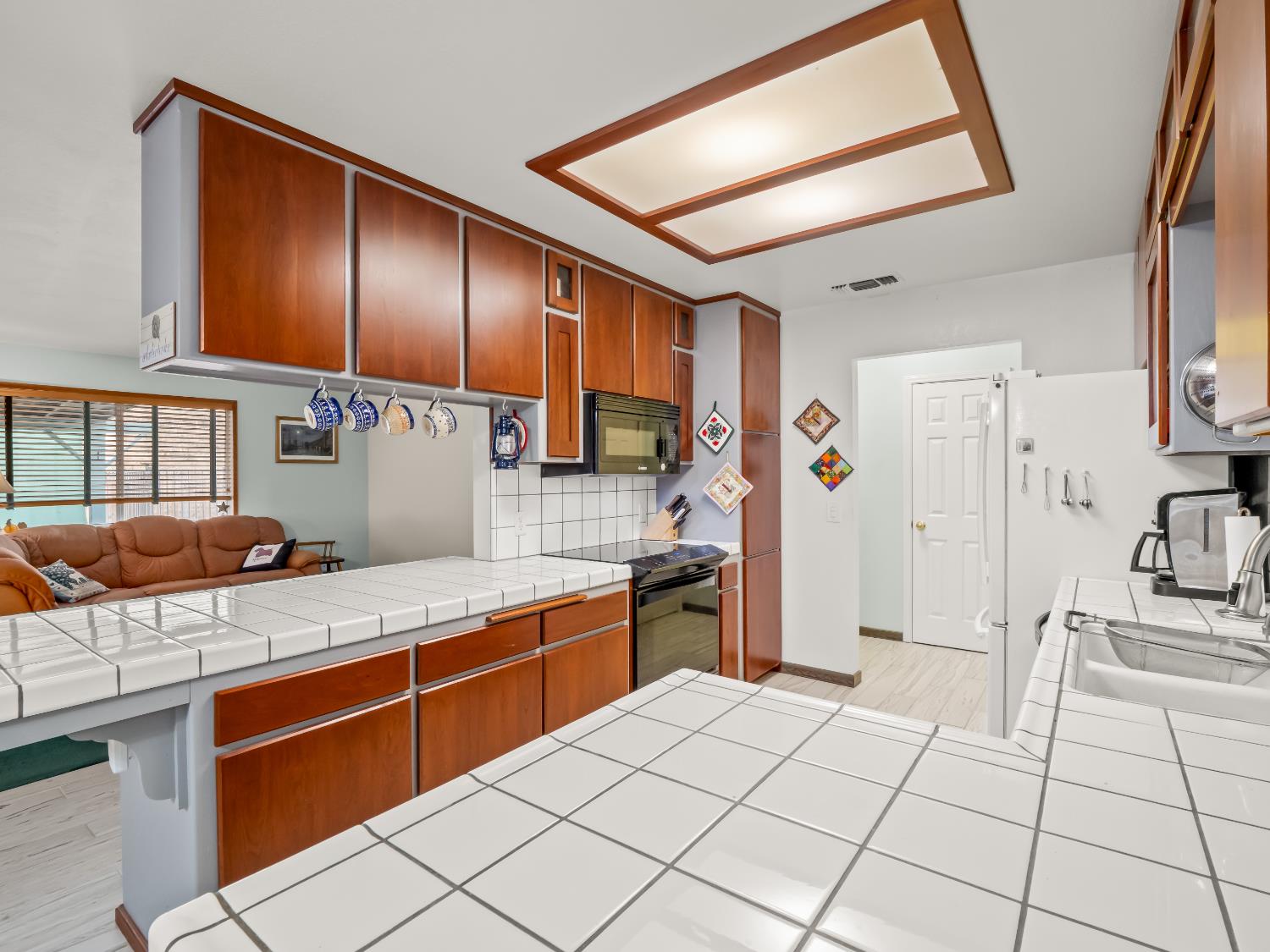 845 Elwood Road Squaw Valley, CA 93675 - Photo 23 of 67 a kitchen with stainless steel appliances granite countertop a stove a sink and a refrigerator