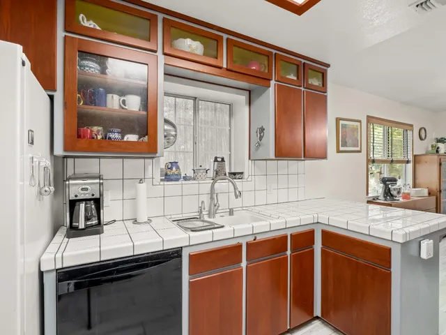 a bed room with a bed and a ceiling fan