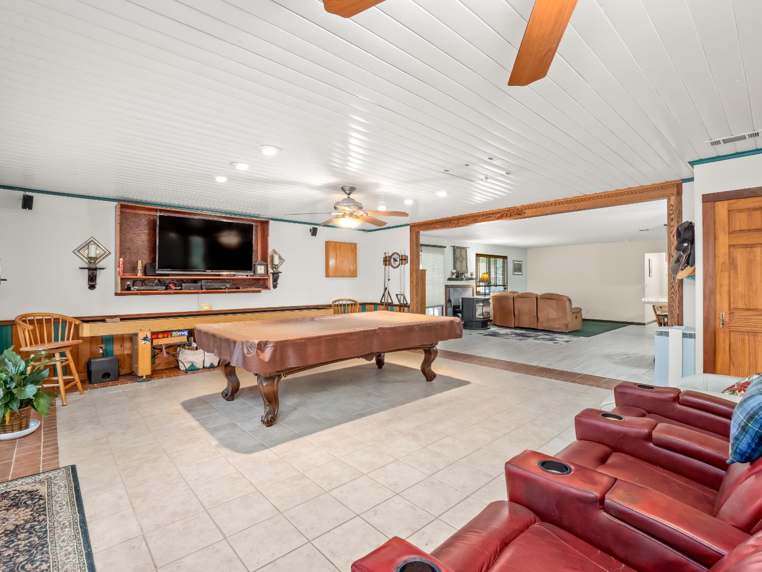 845 Elwood Road Squaw Valley, CA 93675 - Photo 27 of 67 a living room with furniture a flat screen tv and kitchen view
