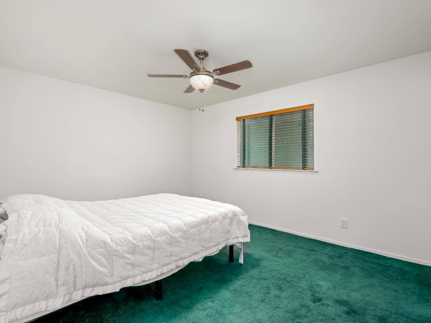 845 Elwood Road Squaw Valley, CA 93675 - Photo 31 of 67 a bedroom with a bed and a ceiling fan