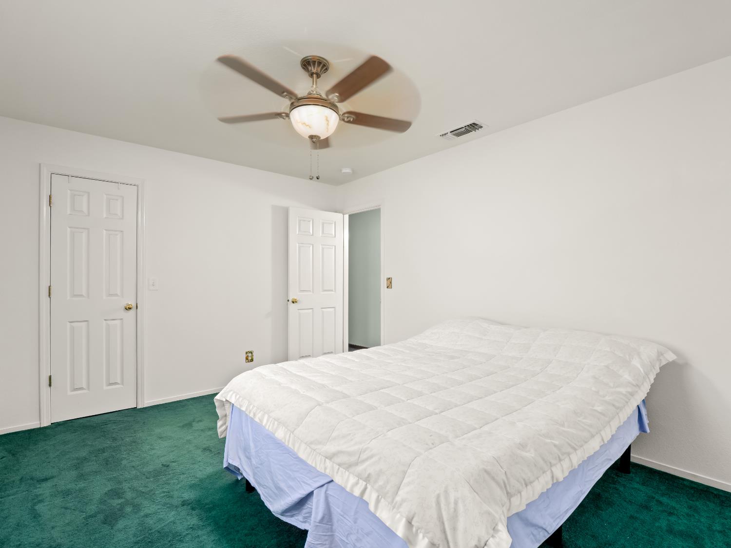 845 Elwood Road Squaw Valley, CA 93675 - Photo 32 of 67 a bed room with a bed and a ceiling fan