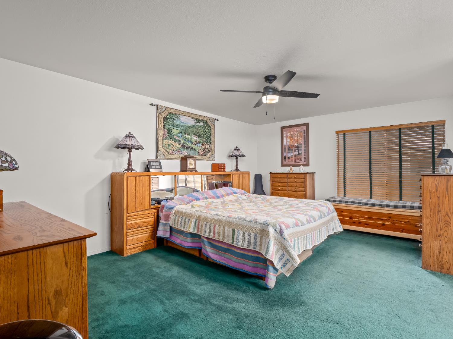 845 Elwood Road Squaw Valley, CA 93675 - Photo 38 of 67 a bedroom with a bed and a chandelier