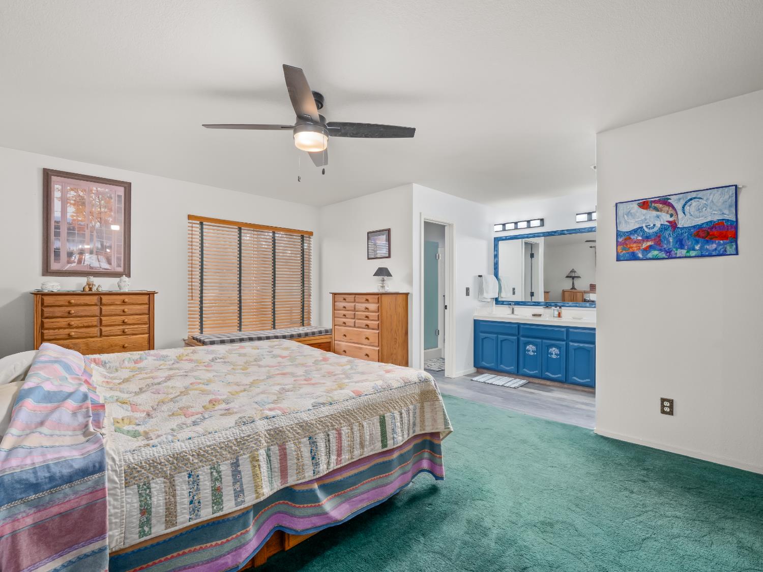 845 Elwood Road Squaw Valley, CA 93675 - Photo 39 of 67 a bedroom with a bed and a chandelier