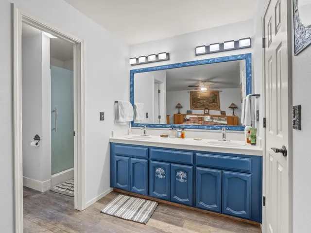 a view of a dirt road with trees in the background