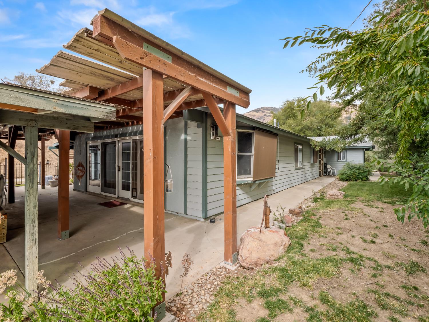 845 Elwood Road Squaw Valley, CA 93675 - Photo 58 of 67 a view of a house with a big yard and potted plants