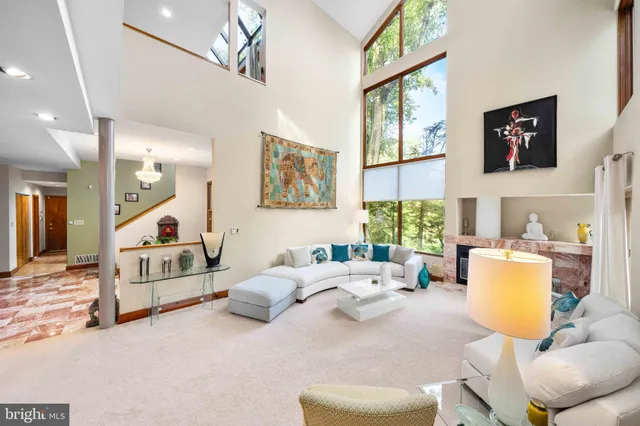 a kitchen with stainless steel appliances a stove a sink dishwasher a refrigerator and cabinets with wooden floor