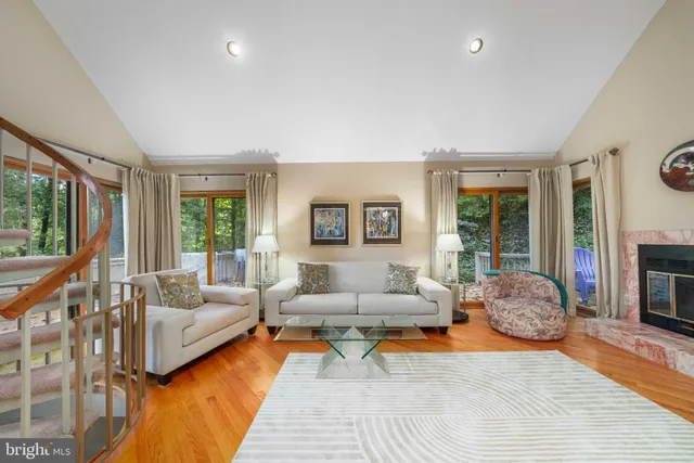 a very nice looking room with many windows and furniture