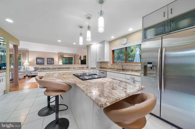 a bedroom with a bed a window and dresser