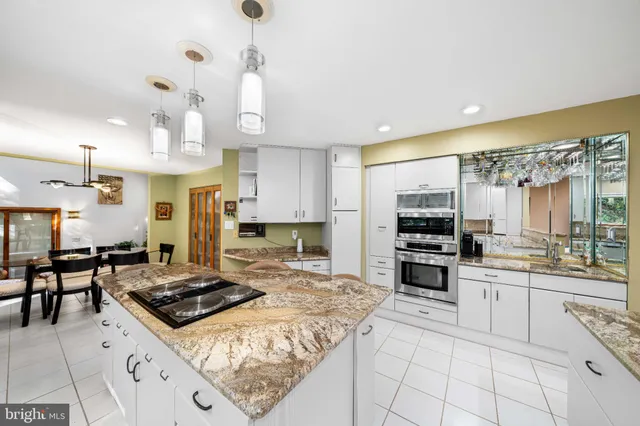 a spacious bathroom with a sink a toilet a shower and a mirror