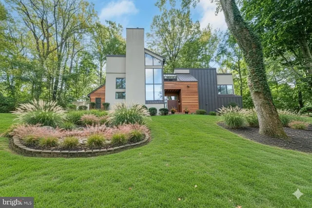 a view of a swimming pool with a yard