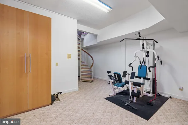 a bedroom with furniture and a large window