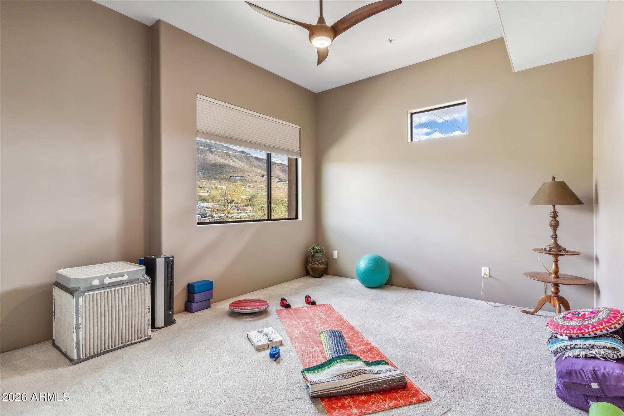 36600 North Cave Creek Road, Unit D11 Cave Creek, AZ 85331 - Photo 19 of 28 a bedroom with a bed and wooden floor