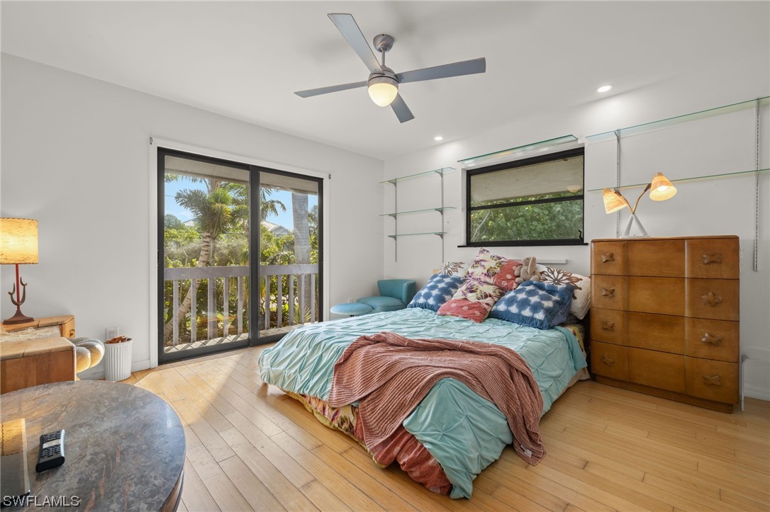 771 Rabbit Road Sanibel, FL 33957 - Photo 15 of 39 a bedroom with a large bed and a tv