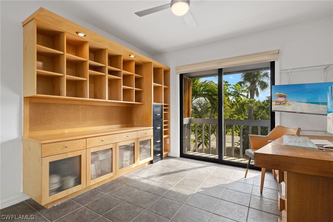771 Rabbit Road Sanibel, FL 33957 - Photo 18 of 39 a living room with stainless steel appliances furniture and a large window