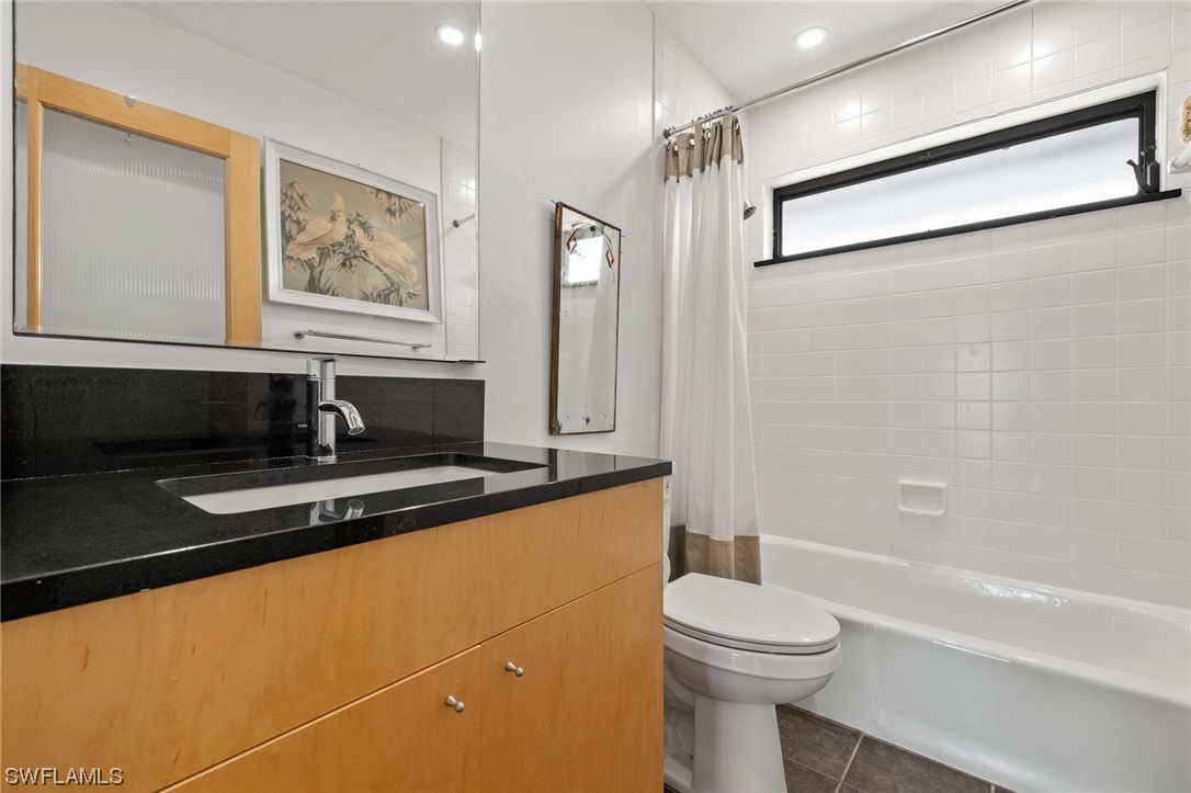 771 Rabbit Road Sanibel, FL 33957 - Photo 19 of 39 a bathroom with a sink a toilet and shower