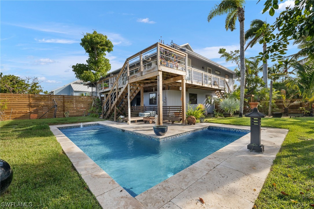 771 Rabbit Road Sanibel, FL 33957 - Photo 22 of 39 a view of a swimming pool with a patio