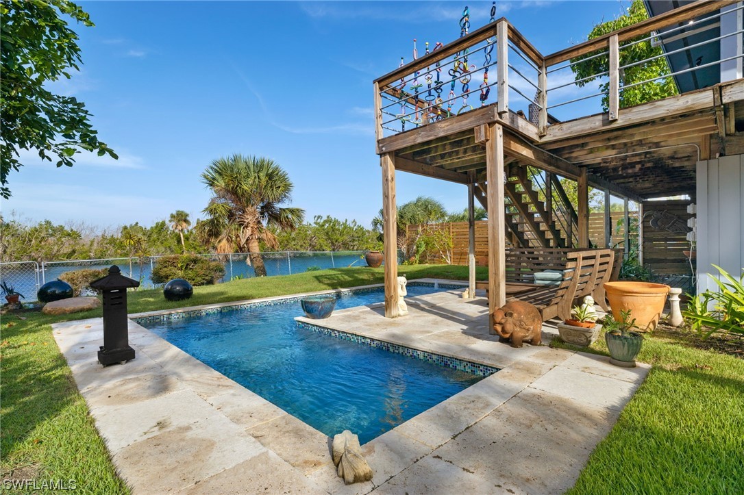 771 Rabbit Road Sanibel, FL 33957 - Photo 23 of 39 an outdoor space with seating