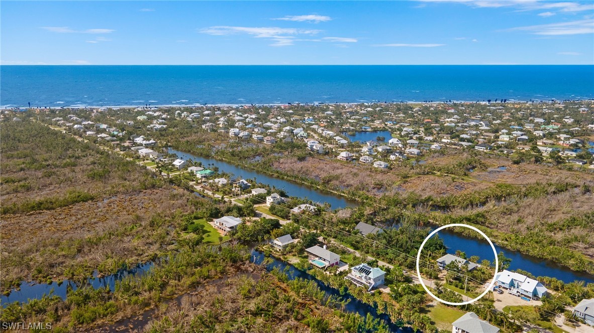 771 Rabbit Road Sanibel, FL 33957 - Photo 26 of 39 a view of roof with wooden floor and bench