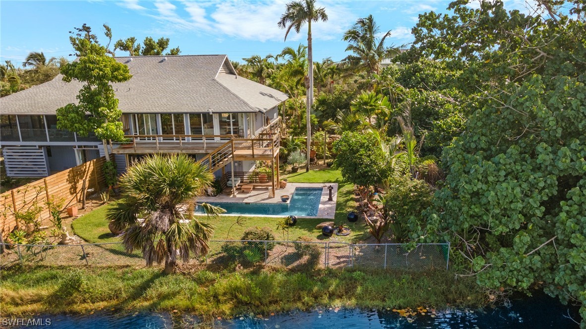771 Rabbit Road Sanibel, FL 33957 - Photo 29 of 39 a view of a house with a yard