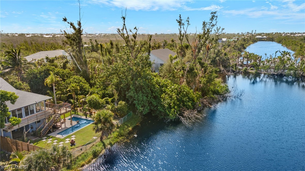 771 Rabbit Road Sanibel, FL 33957 - Photo 31 of 39 a view of a lake with a building in the background