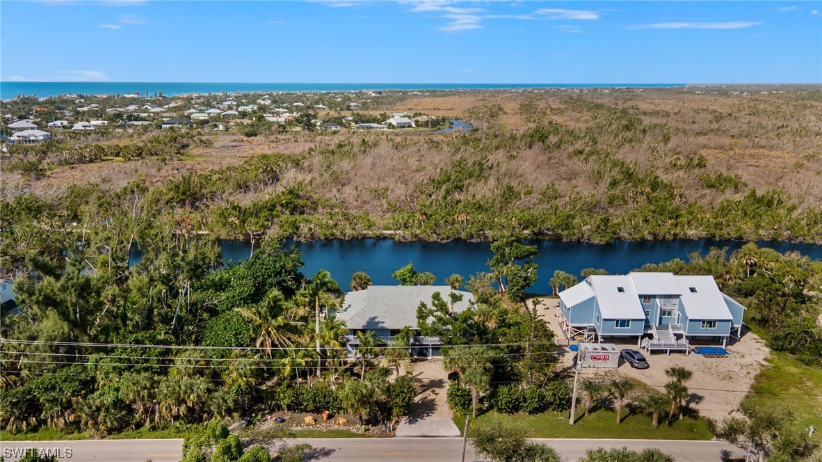 771 Rabbit Road Sanibel, FL 33957 - Photo 34 of 39 an aerial view of residential houses with outdoor space