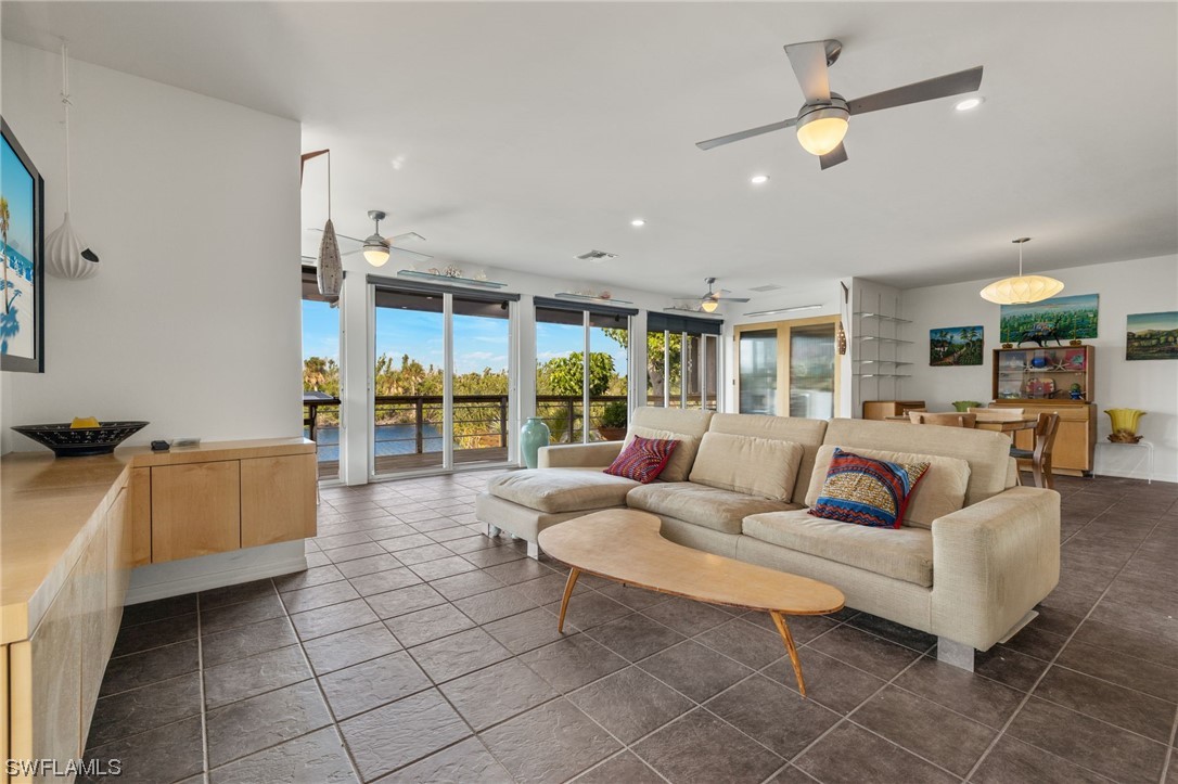 771 Rabbit Road Sanibel, FL 33957 - Photo 4 of 39 a living room with furniture and a large window